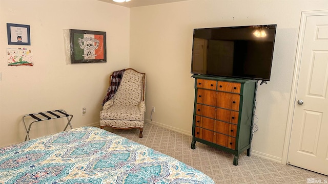 bedroom with light carpet