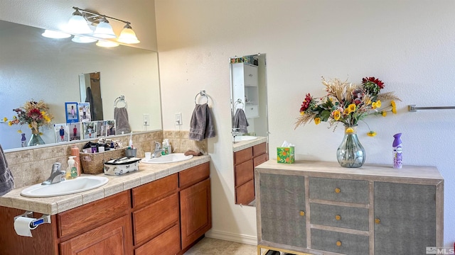 bathroom featuring tasteful backsplash and vanity