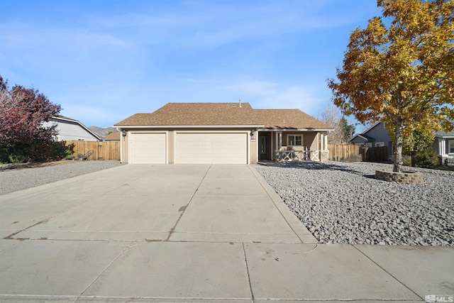 ranch-style house featuring a garage