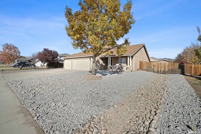 ranch-style home featuring a garage