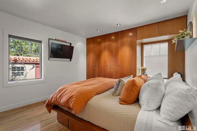 bedroom with light hardwood / wood-style flooring