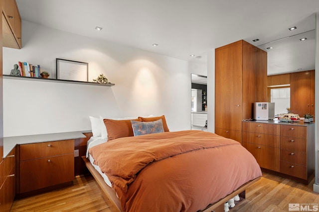 bedroom featuring light hardwood / wood-style flooring