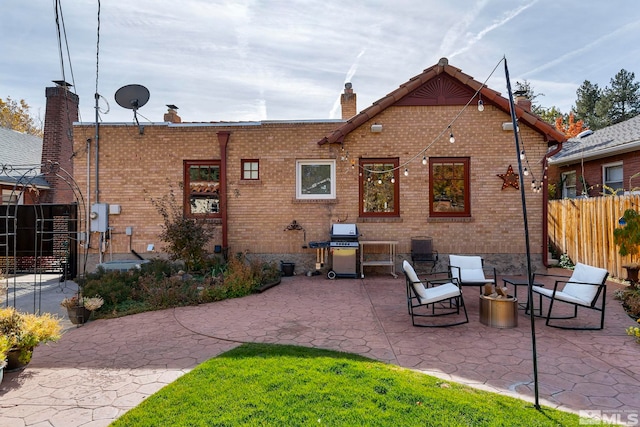 back of house with a patio area