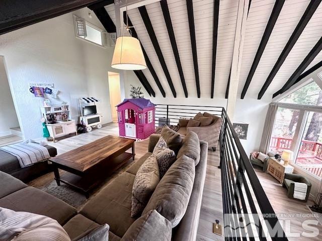 living room with high vaulted ceiling, beamed ceiling, and wood-type flooring