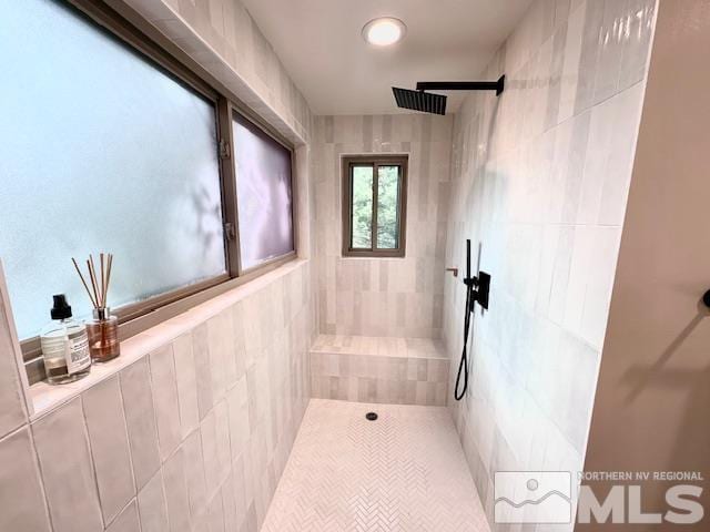 bathroom with a tile shower