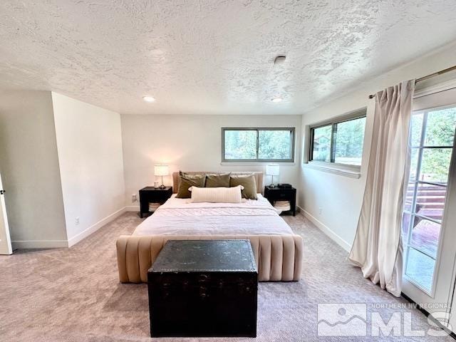 carpeted bedroom with a textured ceiling