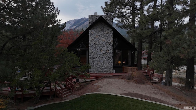 view of property exterior featuring a mountain view