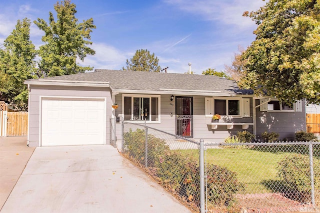 single story home featuring a garage and a front lawn