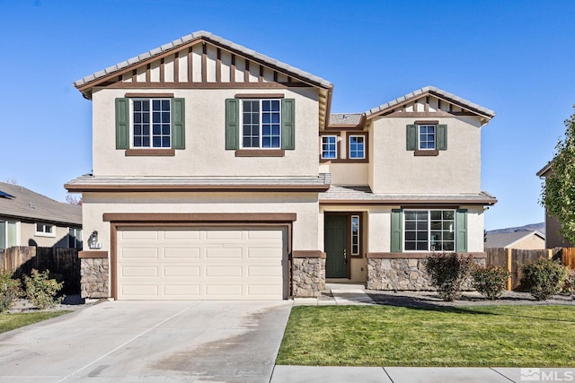 view of front of house featuring a garage and a front lawn