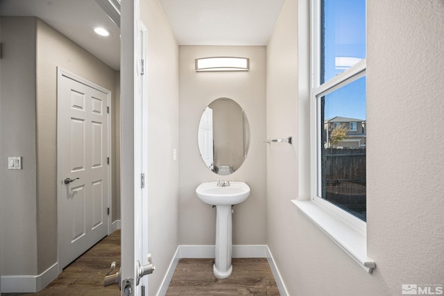 bathroom with wood-type flooring