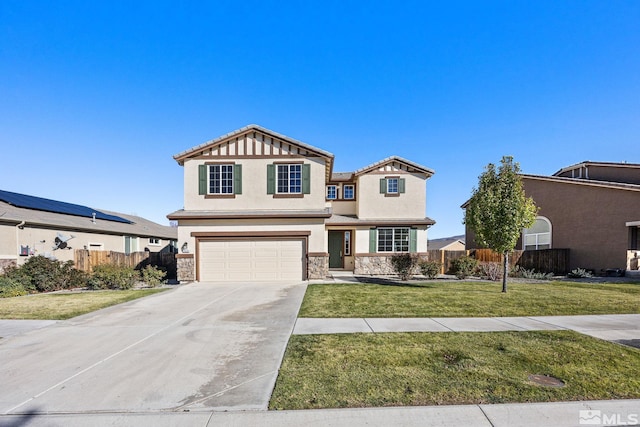 view of front property with a garage and a front lawn