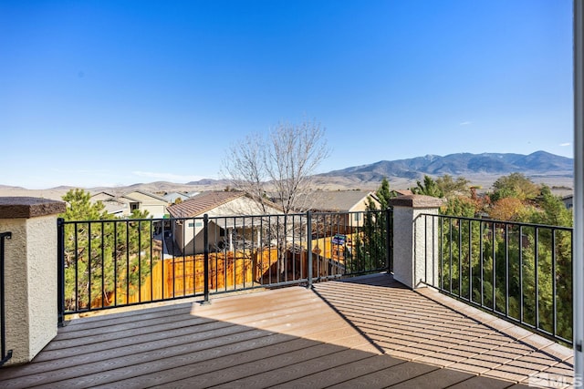 wooden deck with a mountain view