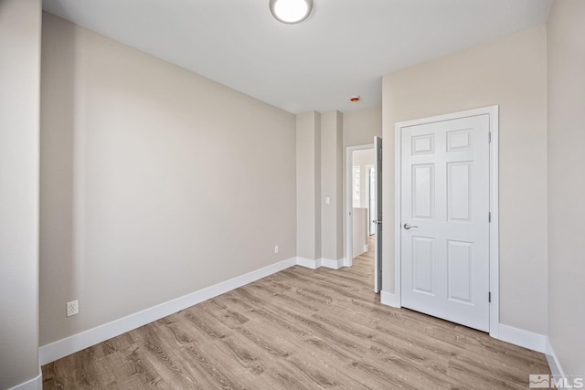 unfurnished bedroom with light hardwood / wood-style flooring