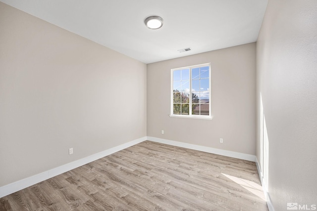 empty room with light hardwood / wood-style floors