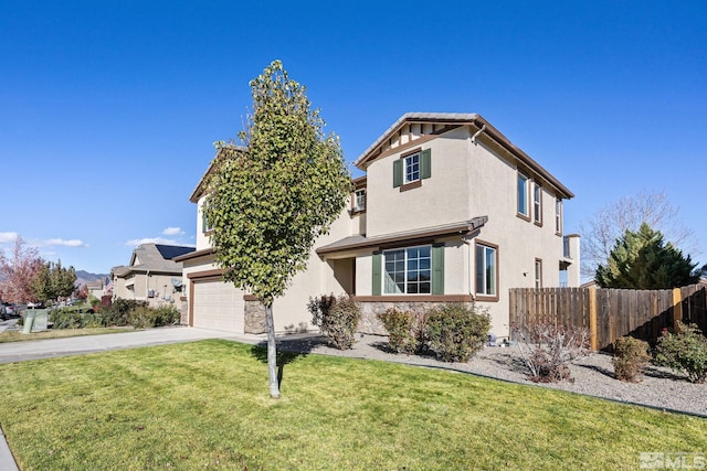 view of front property featuring a garage and a front lawn