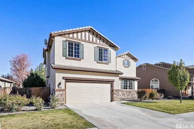 front of property with a garage and a front lawn