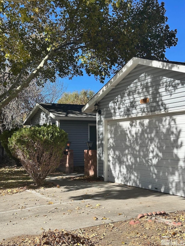 view of side of property with a garage