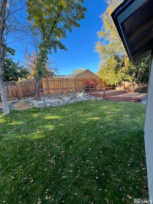 view of yard featuring a wooden deck