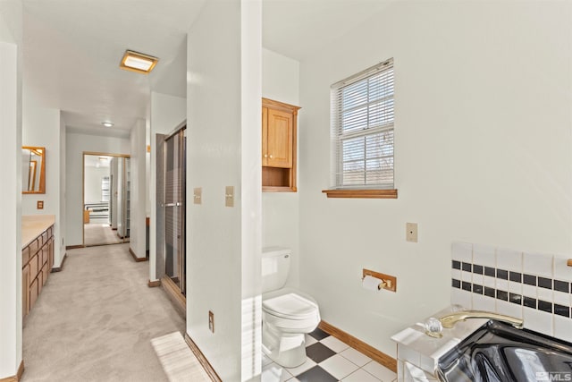 bathroom with vanity, toilet, and walk in shower