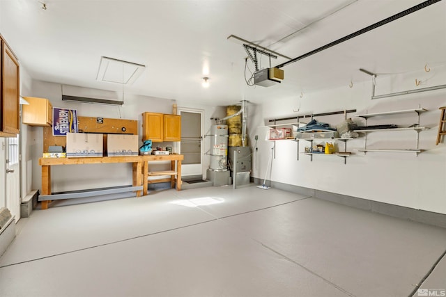 garage featuring a garage door opener and water heater