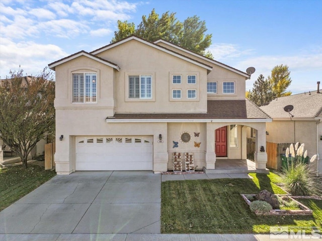 view of front facade featuring a garage and a front yard