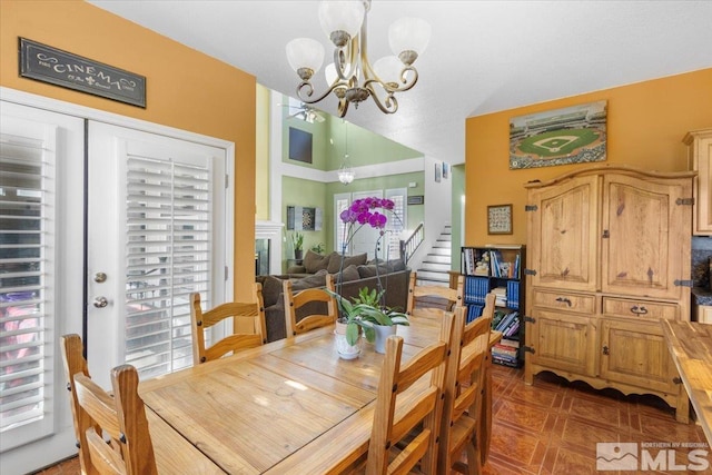 dining area featuring a notable chandelier