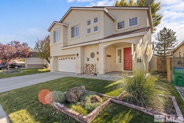 view of property featuring a front lawn and a garage