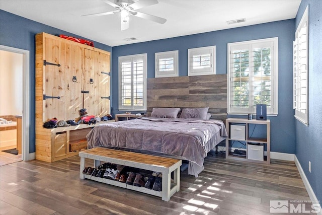 bedroom featuring dark wood-type flooring and ceiling fan