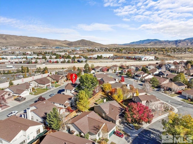 birds eye view of property with a mountain view