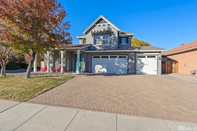 view of front property with a garage and a front lawn