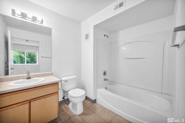 full bathroom featuring toilet, shower / tub combination, vanity, and tile patterned floors