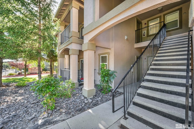 doorway to property featuring a balcony