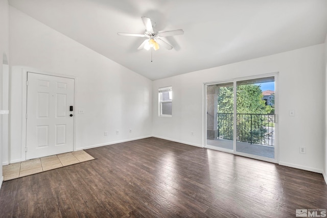 unfurnished room with ceiling fan, lofted ceiling, and dark hardwood / wood-style floors