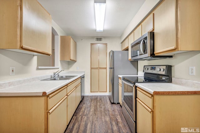 kitchen featuring light brown cabinets, stainless steel appliances, sink, and dark hardwood / wood-style floors