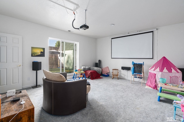 home theater featuring carpet and a textured ceiling