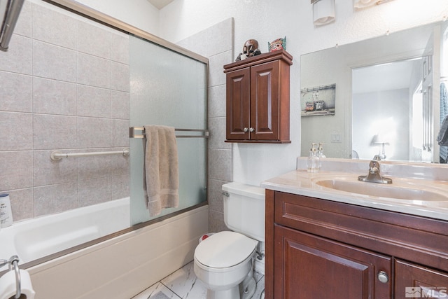 full bathroom featuring shower / bath combination with glass door, toilet, and vanity