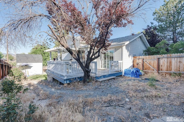 back of property featuring a deck