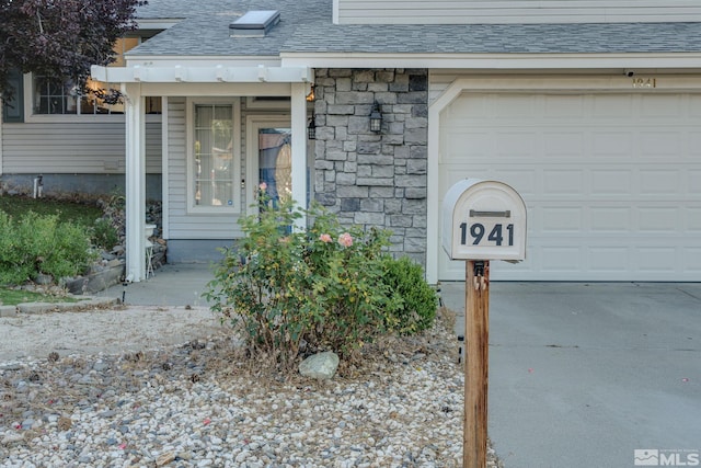 entrance to property featuring a garage