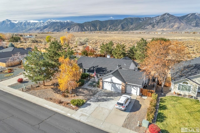 birds eye view of property featuring a mountain view