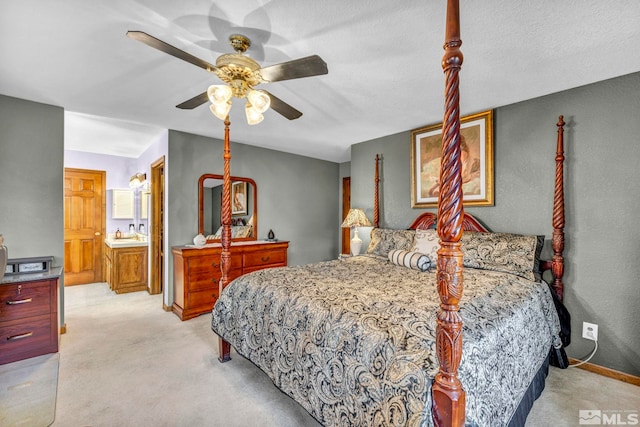 carpeted bedroom featuring ceiling fan, a textured ceiling, sink, and connected bathroom