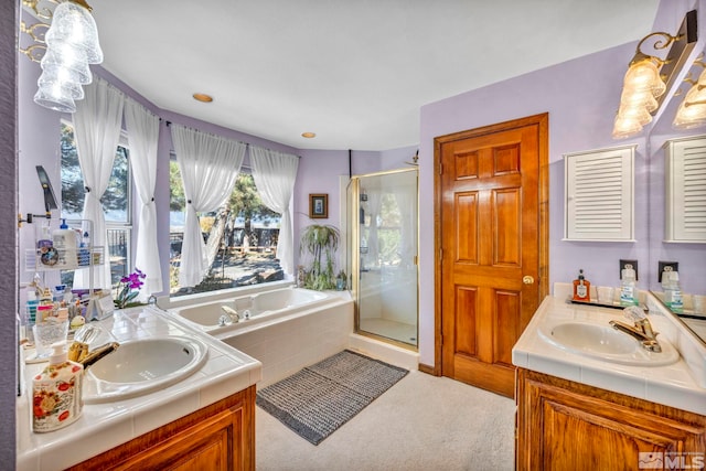 bathroom featuring vanity and plus walk in shower