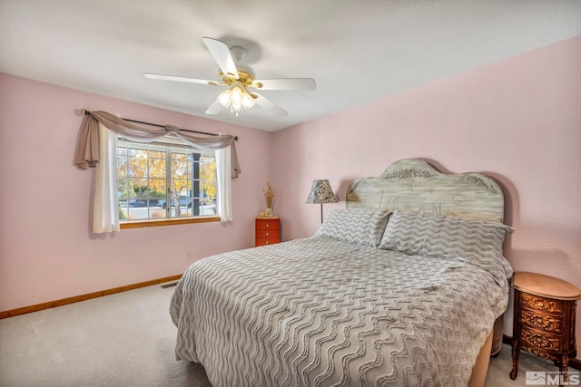 bedroom with ceiling fan and carpet