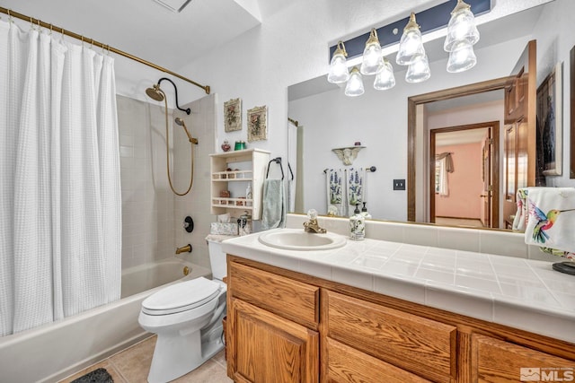 full bathroom featuring vanity, shower / bath combo with shower curtain, tile patterned flooring, and toilet