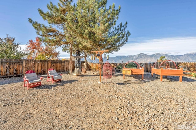 view of playground featuring a mountain view