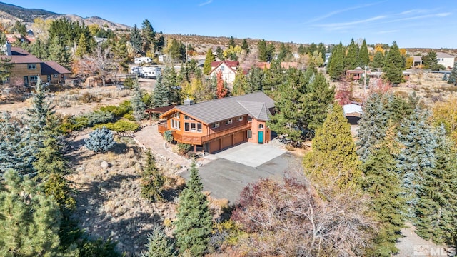 birds eye view of property with a mountain view