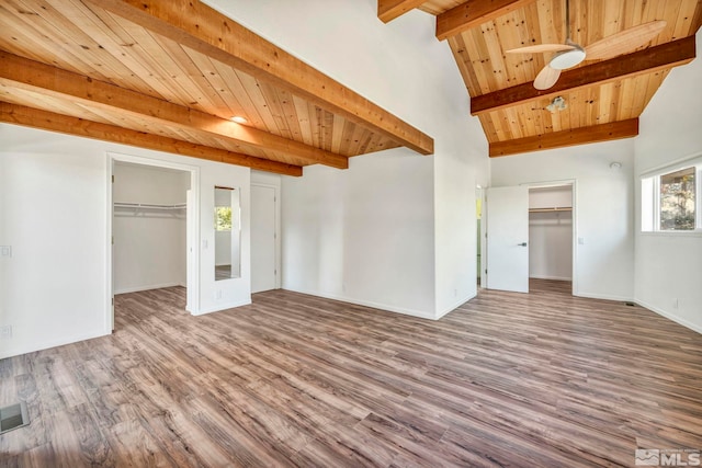 interior space with wood-type flooring, vaulted ceiling with beams, and wooden ceiling