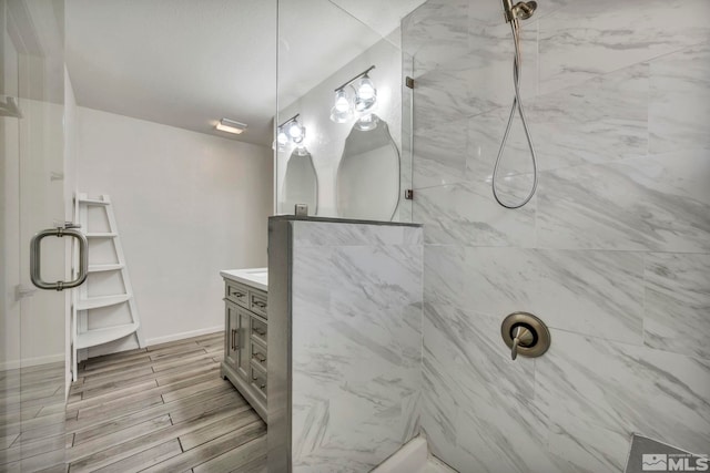 bathroom featuring vanity and a tile shower