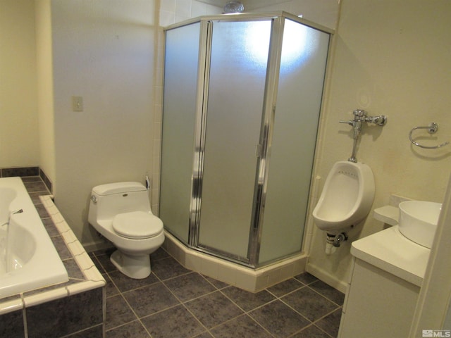 bathroom with toilet, tile patterned floors, and walk in shower