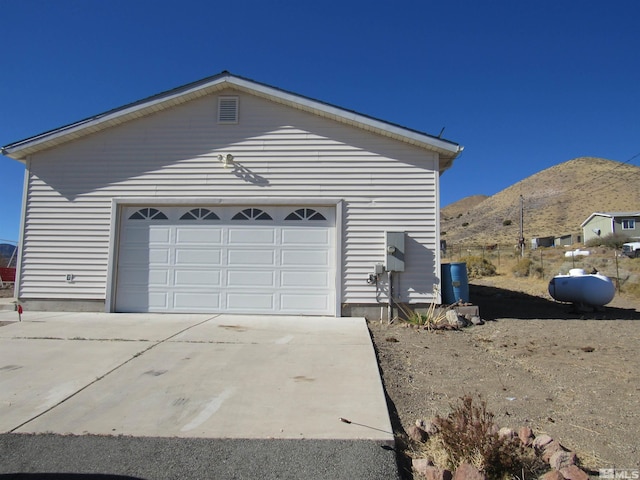 garage featuring a mountain view