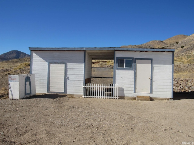 view of outbuilding featuring a mountain view